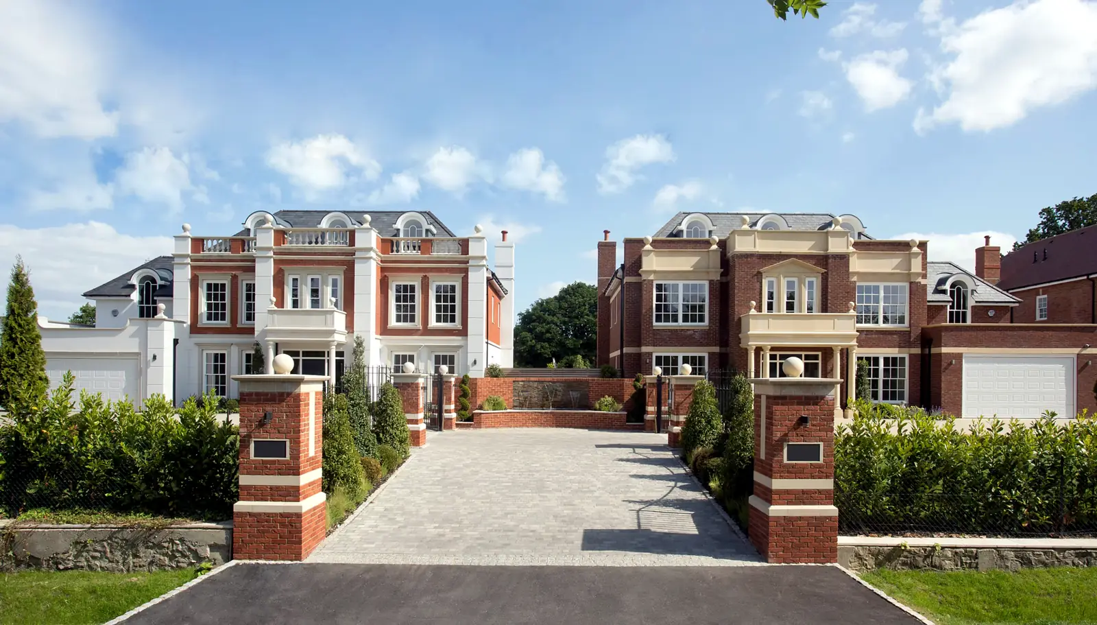 Two grand new-build red-brick Surrey homes with timber Georgian sash windows