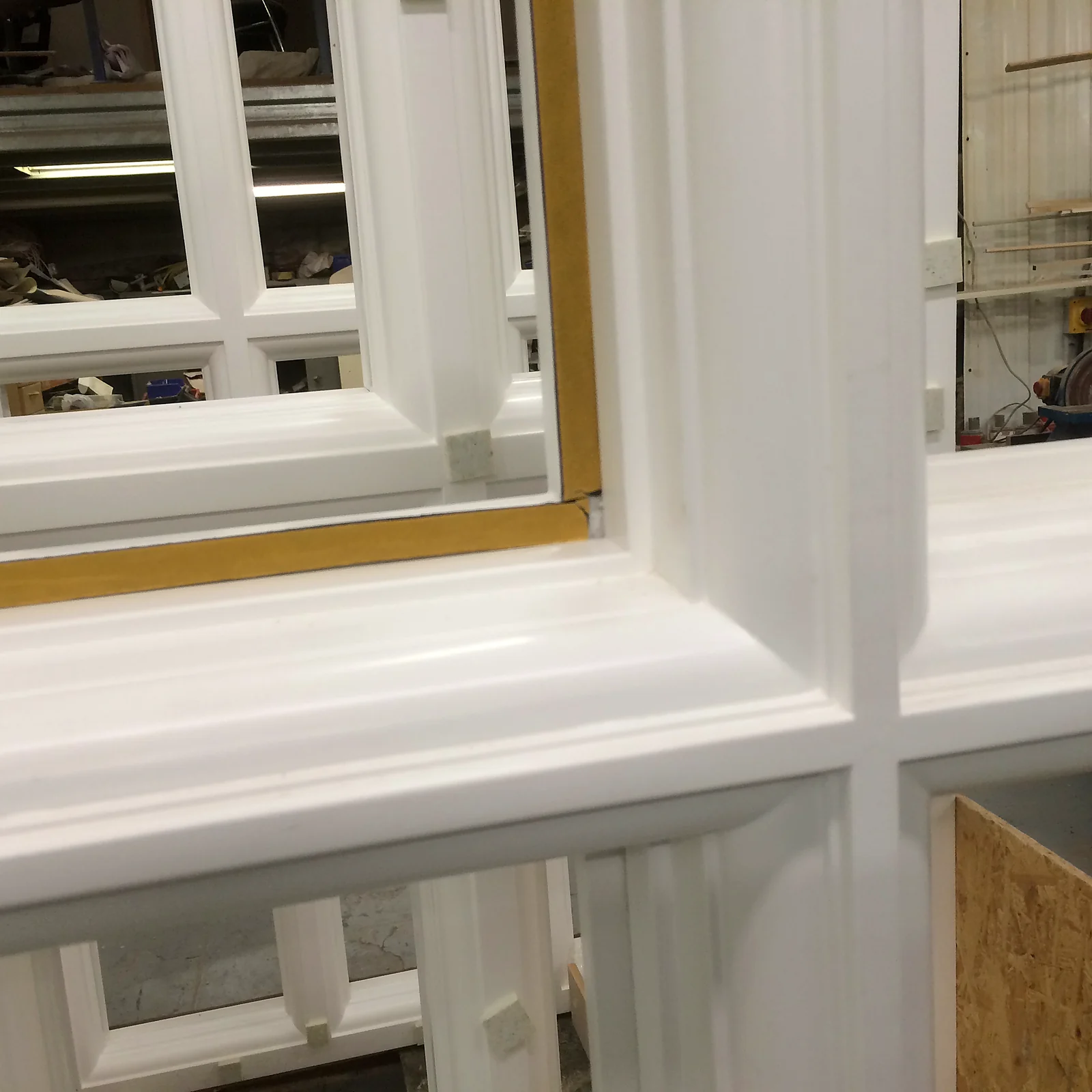 Close-up of hand-finished moulding and glazing-bar junction on a timber window