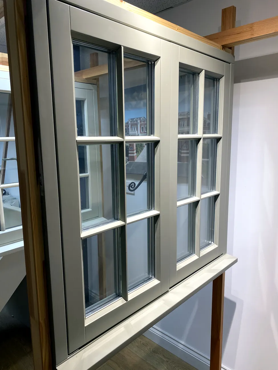 Multi-pane timber Georgian casement windows with monkey-tail casement stays