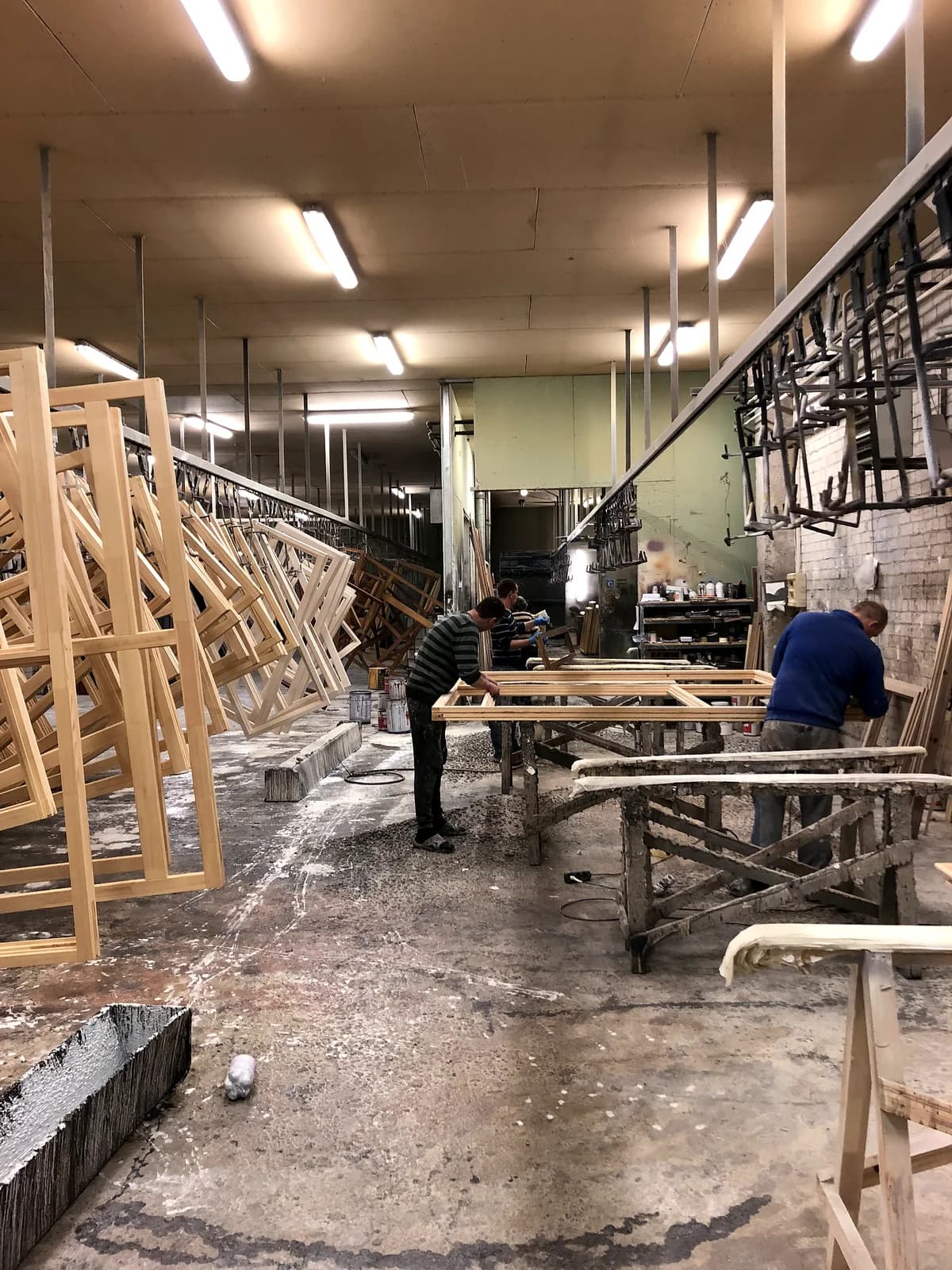 Skilled joiners assembling and finishing timber window frames at our European partner factory