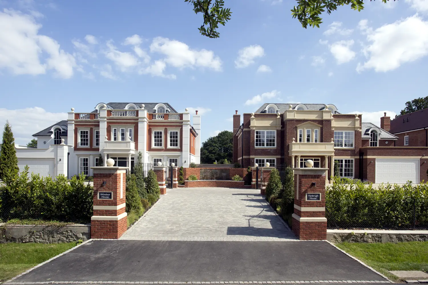 Front elevation of Windsor House, a Surrey new-build with timber sash windows and white render